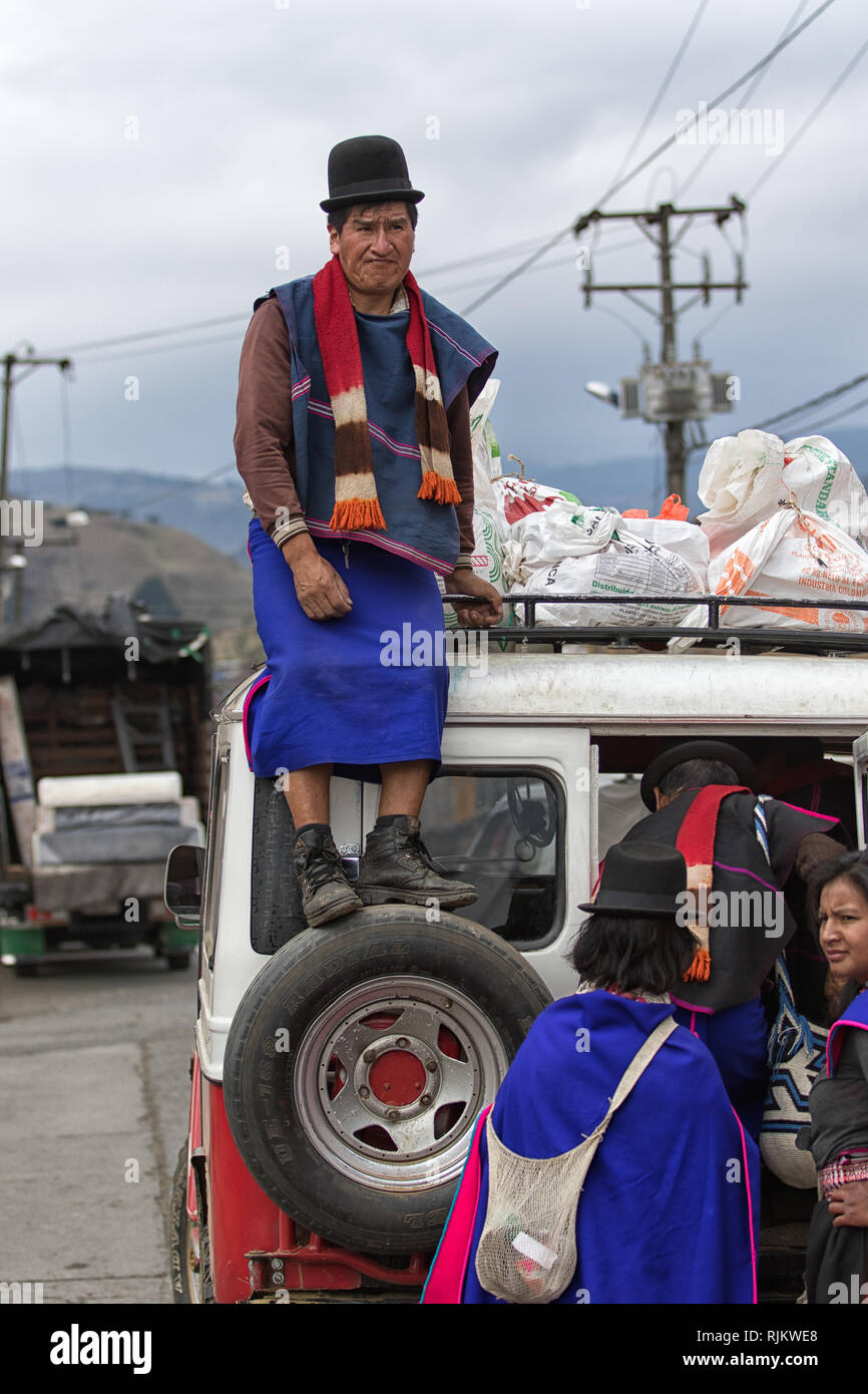 Silvia, Colombia - September 11, 2018: man sitting on the top odf an old vehicle used for local transportation Stock Photo