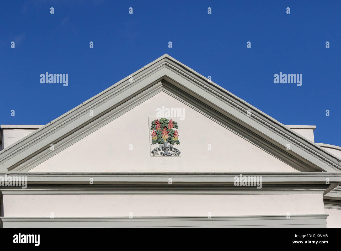 Presbyterian Church portico with the Ardens sed Virens motto and logo on white background. Stock Photo