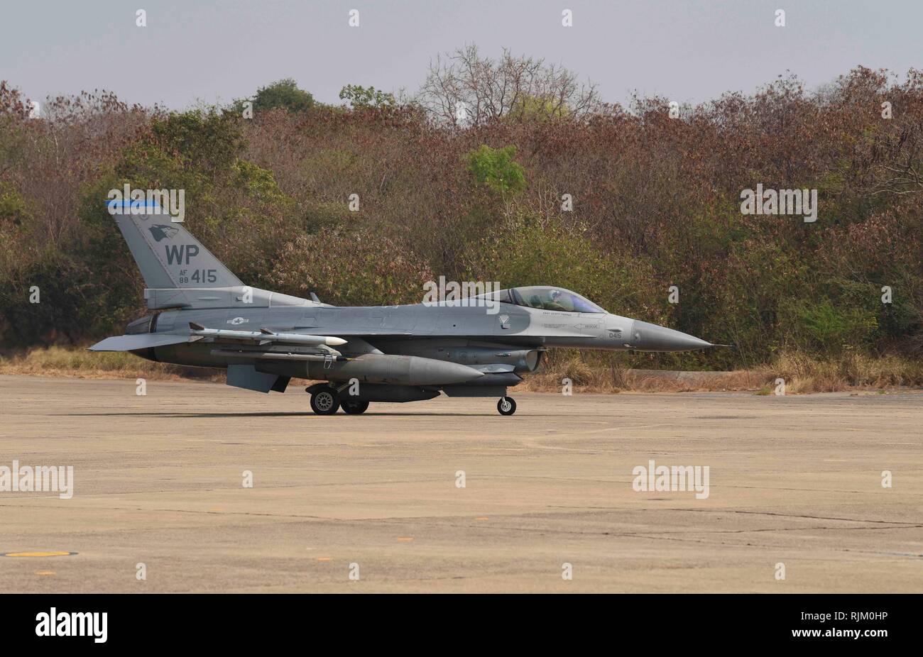 A U.S. Air Force F-16 Fighting Falcon, assigned to the 35th Fighter Squadron, Republic of Korea, taxis after landing for Exercise Cobra Gold 2019 at Korat Royal Thai Air Force Base, Thailand, Feb. 6, 2019. Cobra Gold is the largest Theater Security Cooperation exercise in the Indo-Asia-Pacific region and is an integral part of the U.S. commitment to strengthen engagement in the region. (U.S. Air Force photo by Senior Airman Savannah L. Waters) Stock Photo