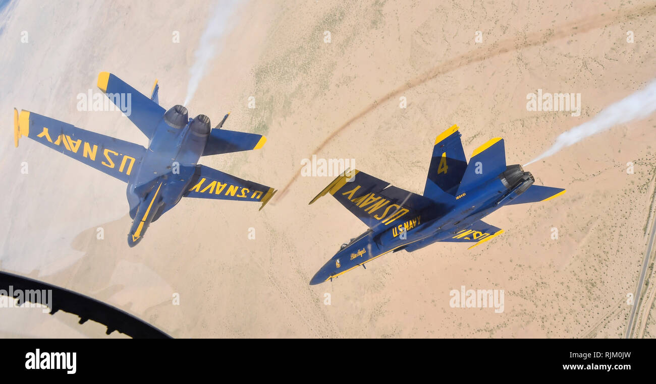 EL CENTRO, Calif. (Feb. 4, 2019) The U.S. Navy Flight Demonstration Squadron, the Blue Angels, diamond pilots perform the diamond roll maneuver over the Imperial Valley during a training flight. The Blue Angels are conducting winter training at Naval Air Facility El Centro, California, in preparation for the 2019 show season. The team is scheduled to conduct 61 flight demonstrations at 32 locations across the country to showcase the pride and professionalism of the U.S. Navy and Marine Corps to the American public. U.S. Navy photo by Mass Communication Specialist 1st Class Ian Cotter (Released Stock Photo