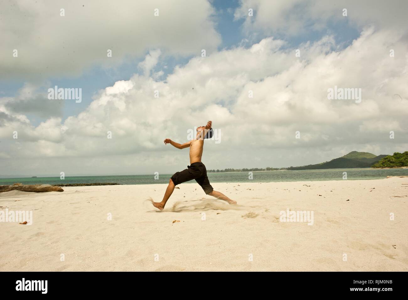 spectacular kick by the beach Stock Photo