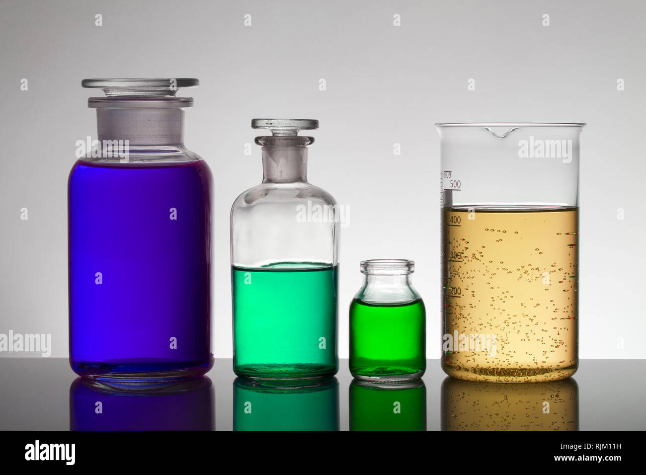 Liquid in laboratory bottles. Scientific biochemical laboratory ...