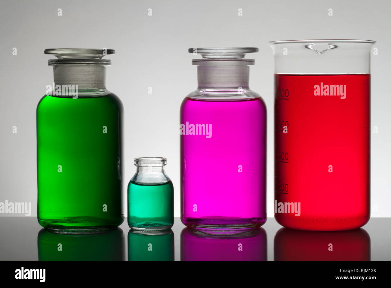 Liquid in laboratory bottles. Scientific biochemical laboratory