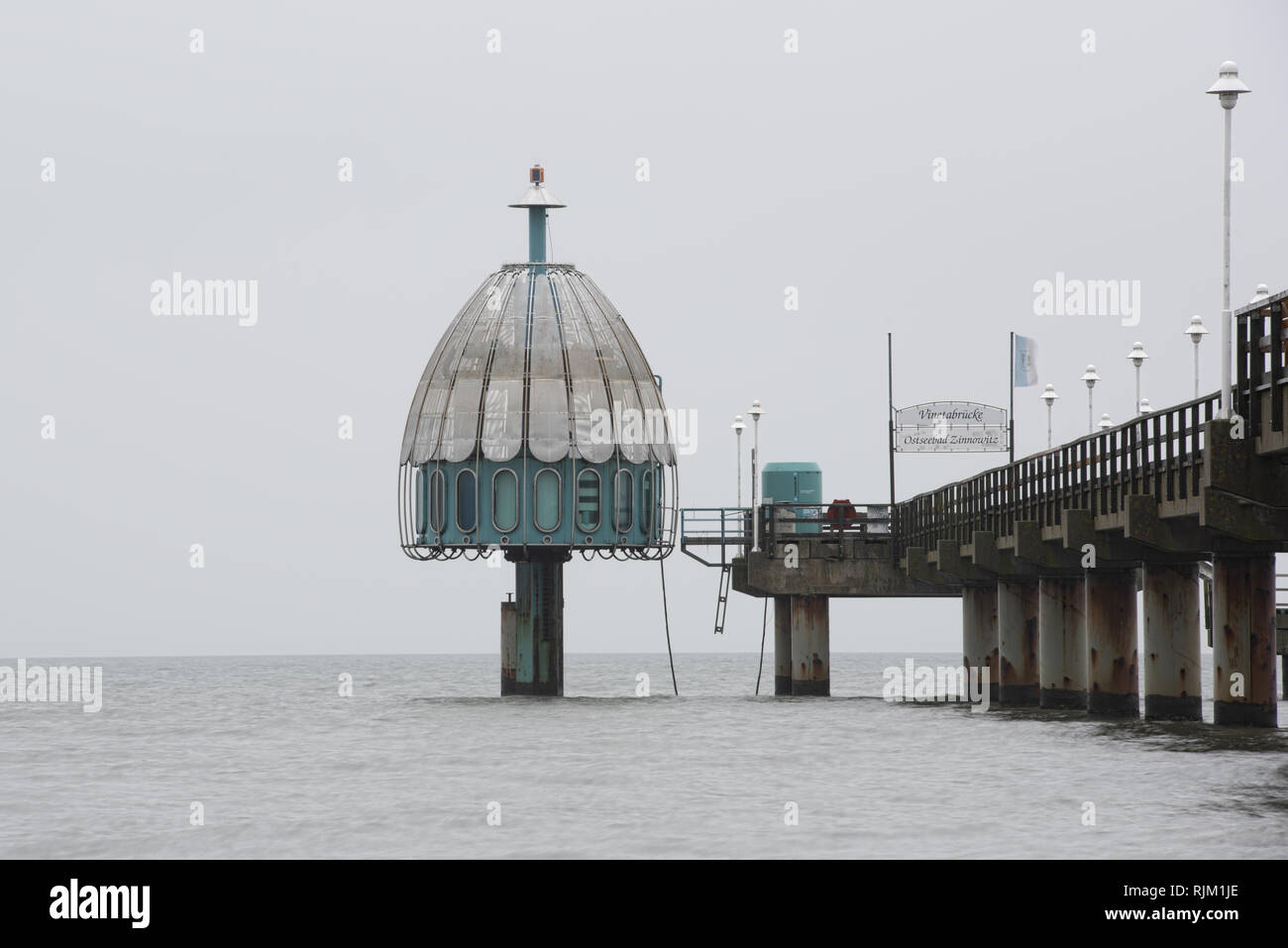 Vineta bridge Baltic Zinnowitz and diving bell on the island of Usedom - Translation of the text on the sign: 'Vineta bridge' 'Baltic Sea bath Zinnowi Stock Photo