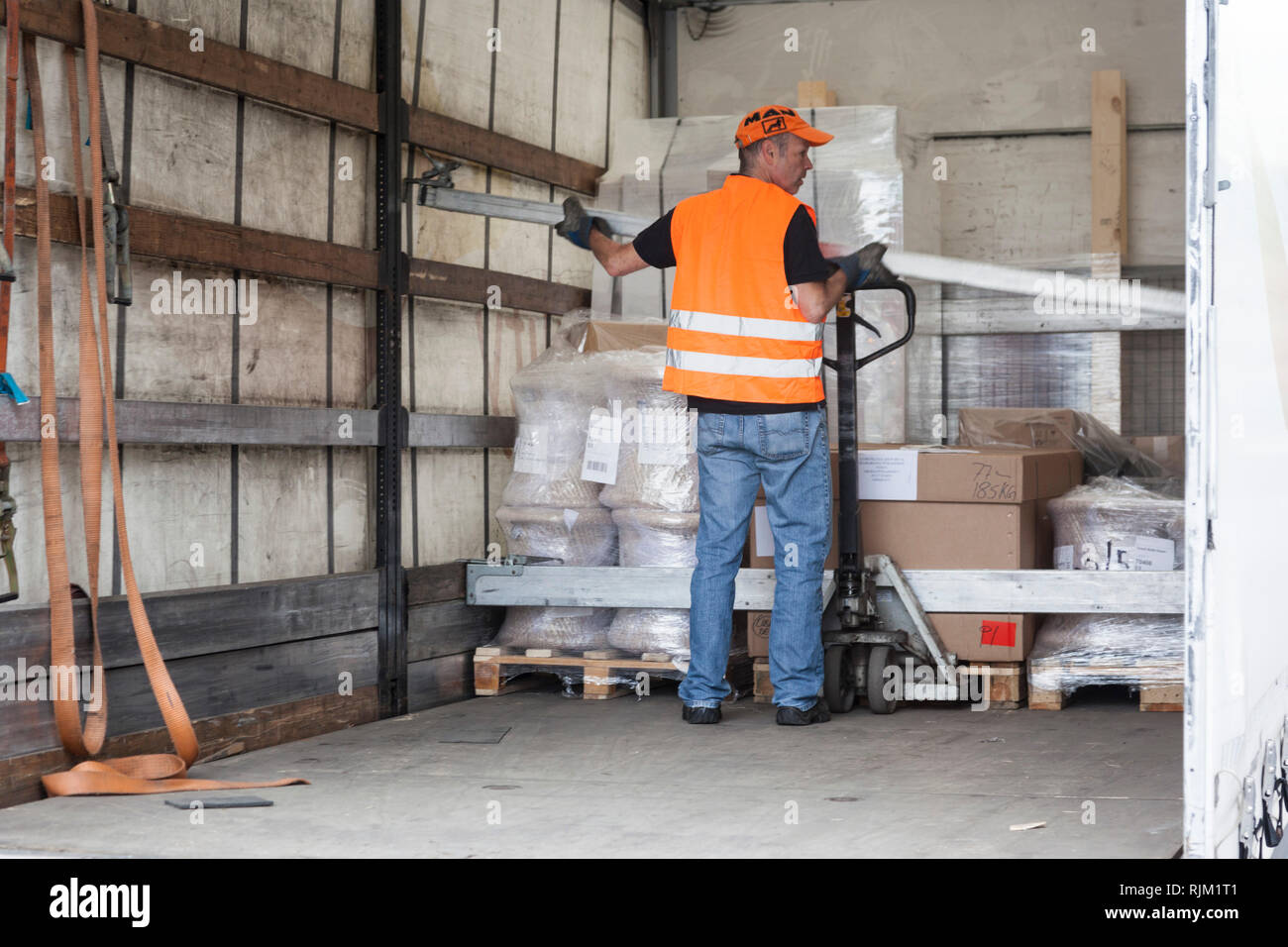 Motorist in load securing Stock Photo