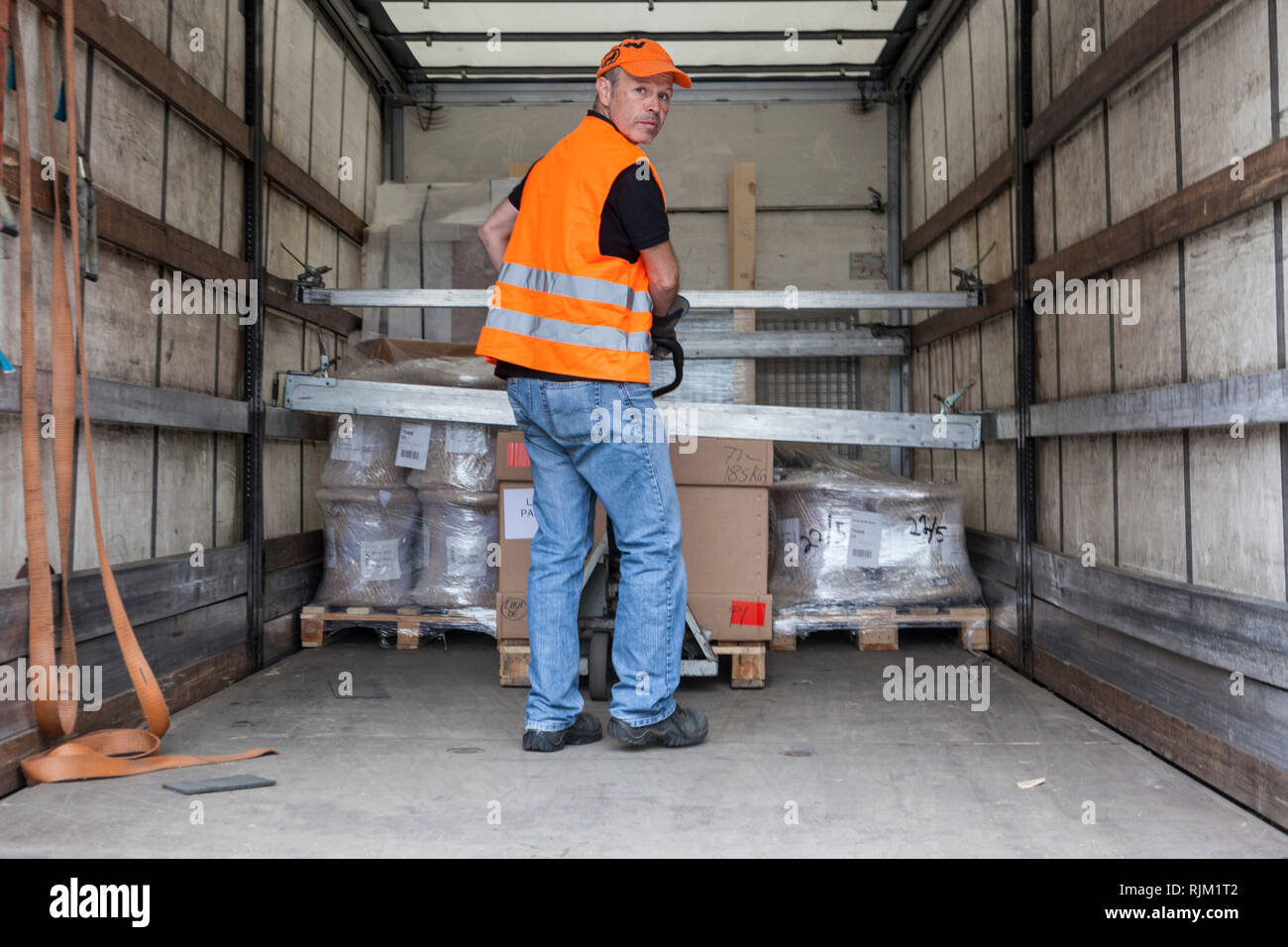 Motorist in load securing Stock Photo
