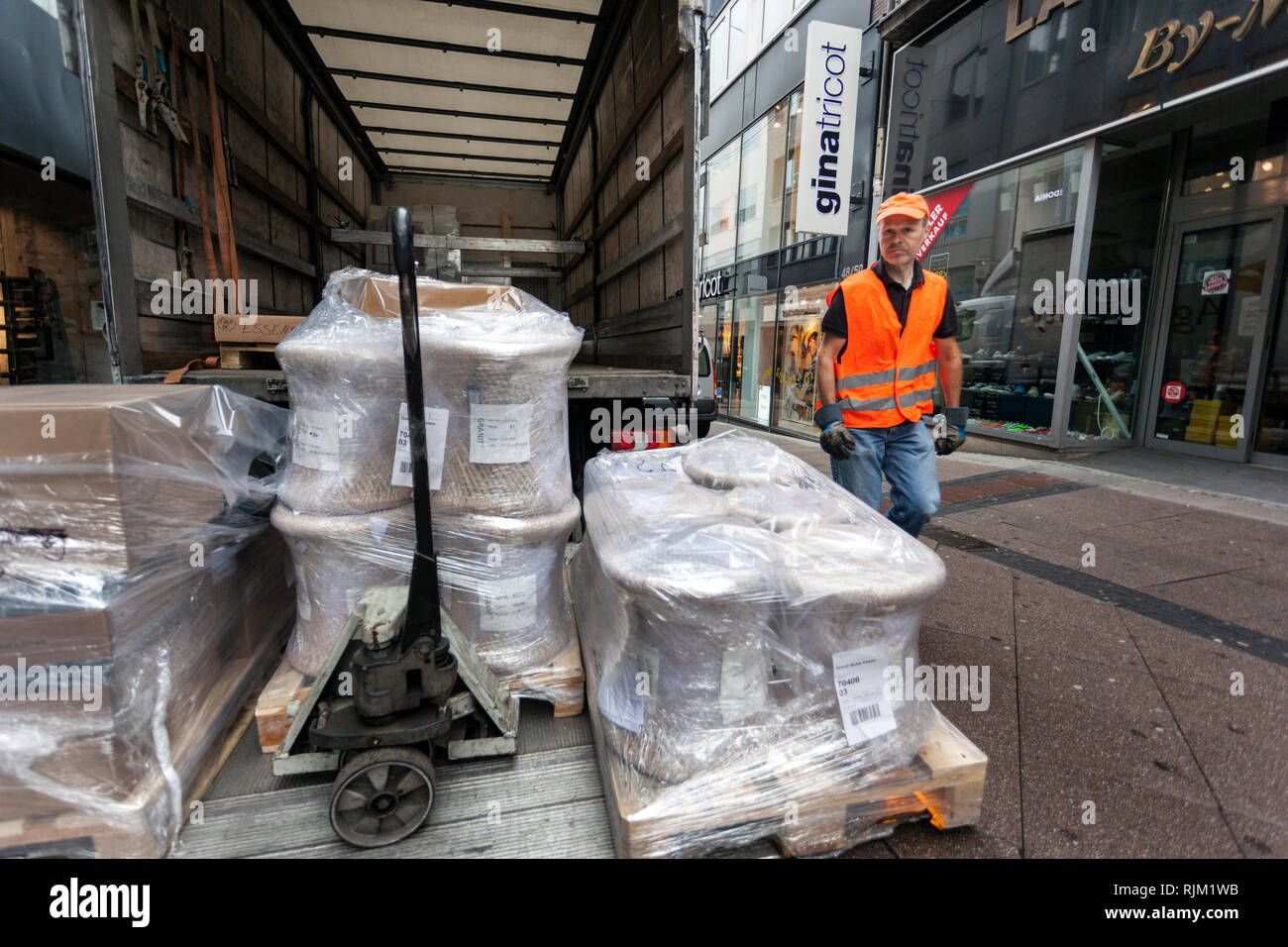 Spedition delivers bulky goods in the pedestrian zone Stock Photo