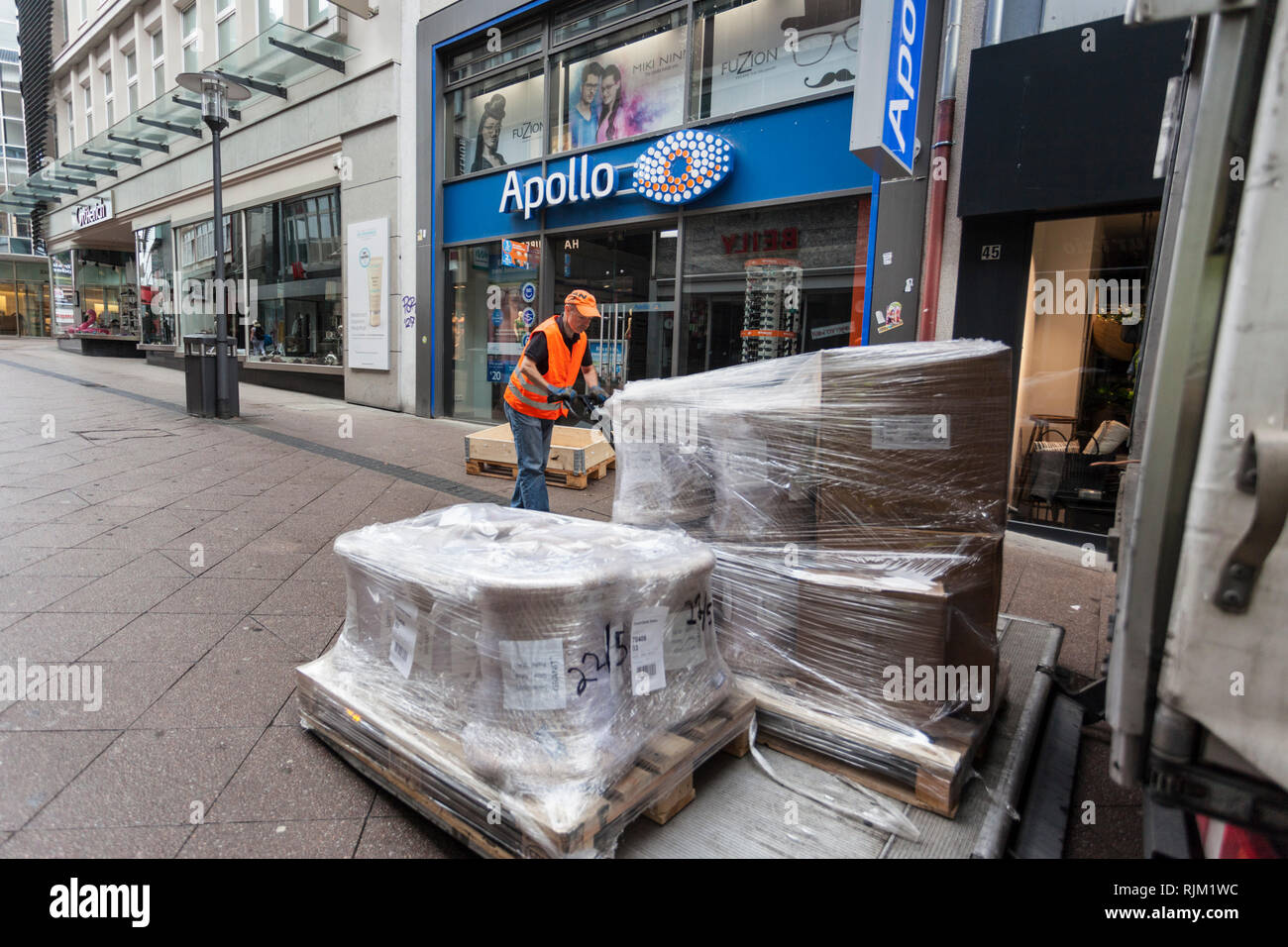 Spedition delivers bulky goods in the pedestrian zone Stock Photo Alamy