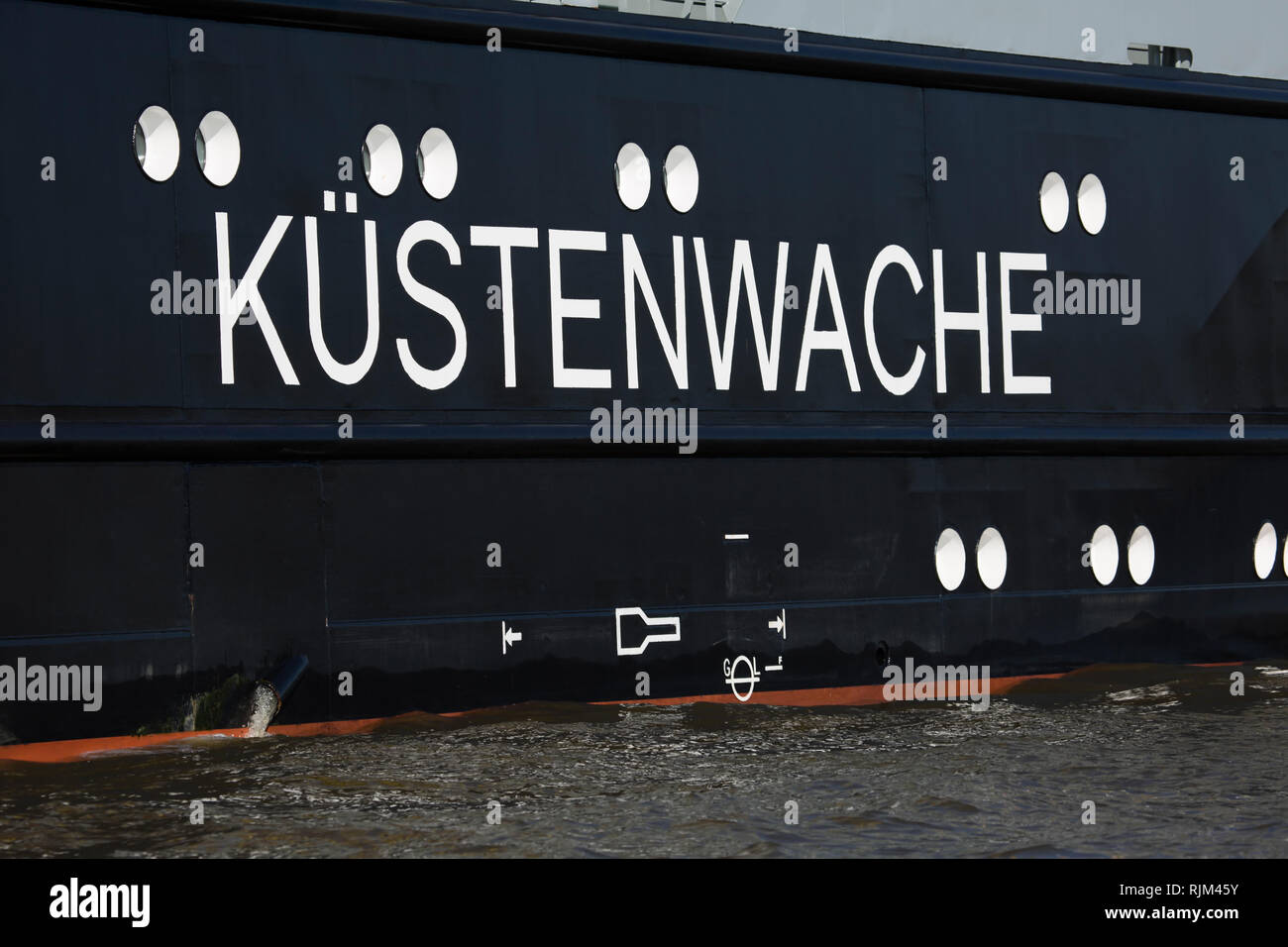 Side of an ship with the german word for coastguard Küstenwache Stock Photo