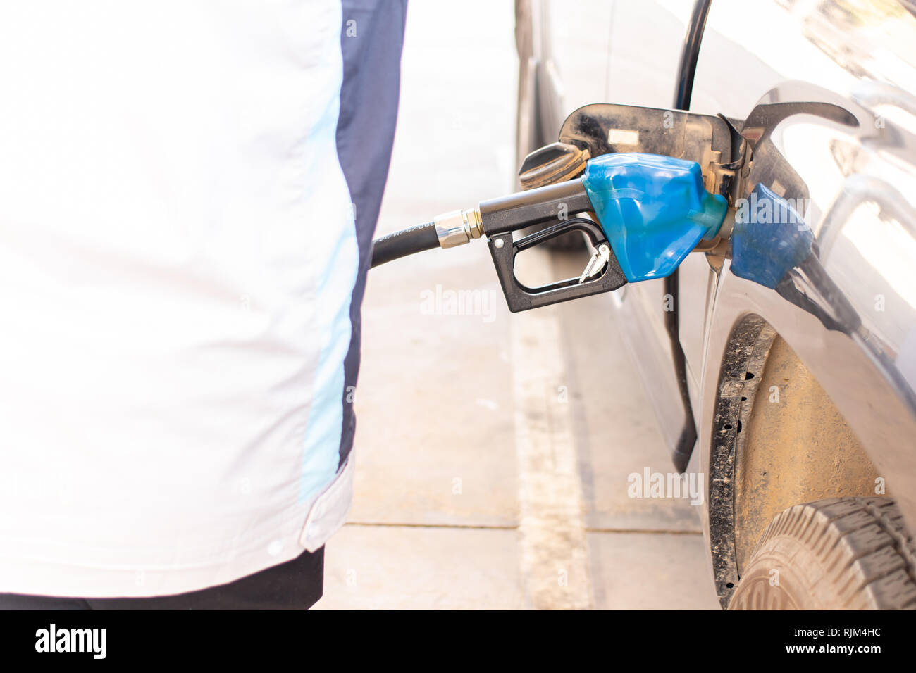 Blue color fuel pump gun hi-res stock photography and images - Alamy