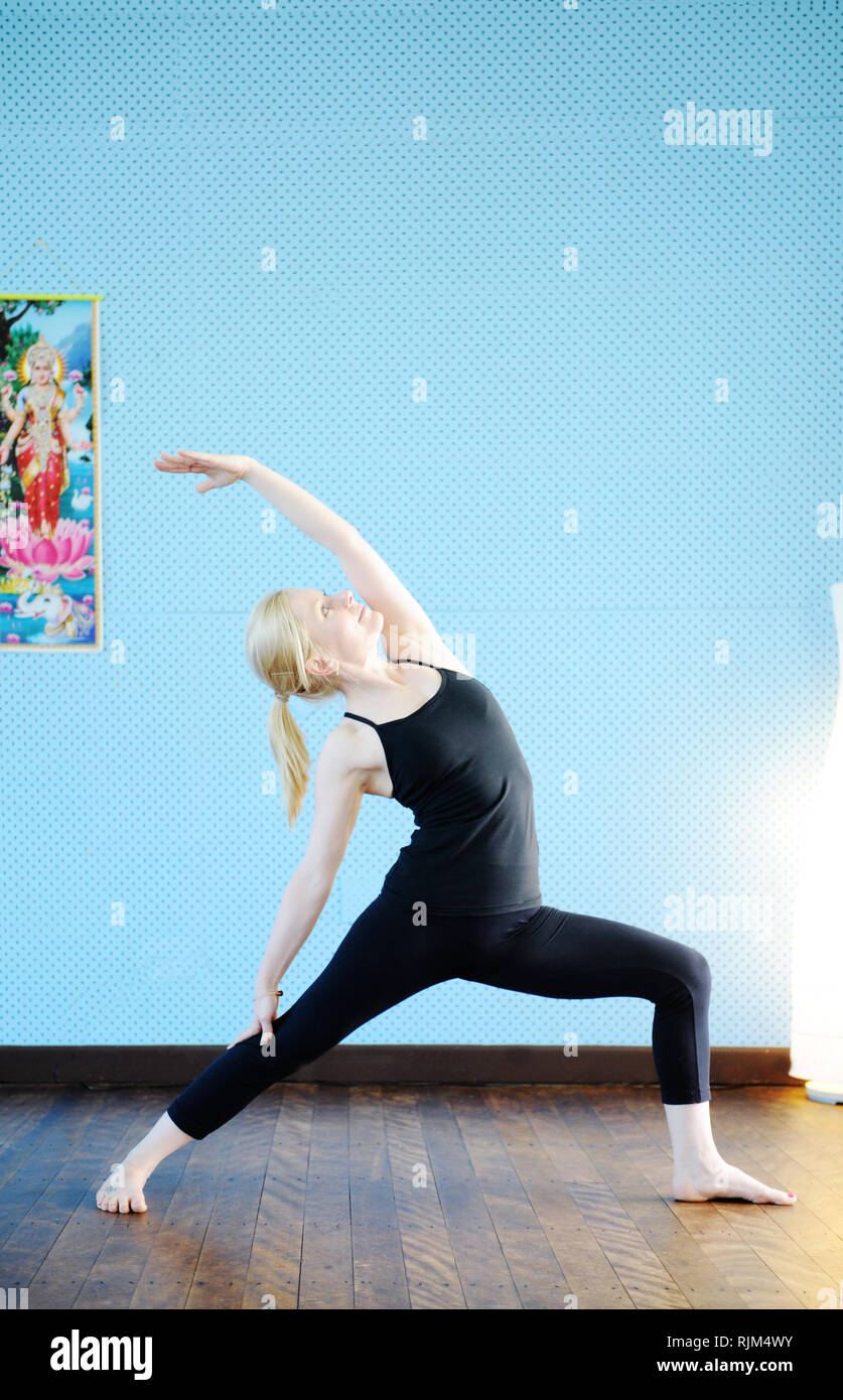 Woman practicing yoga Stock Photo