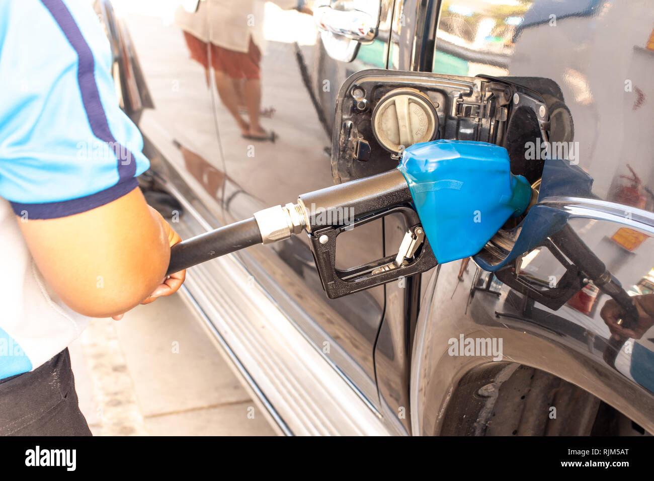 Blue color fuel pump gun hi-res stock photography and images - Alamy