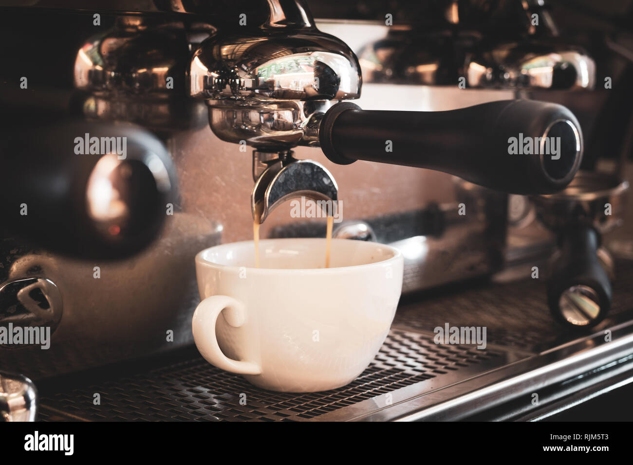 Coffee machine preparing fresh coffee in white cup Stock Photo Alamy