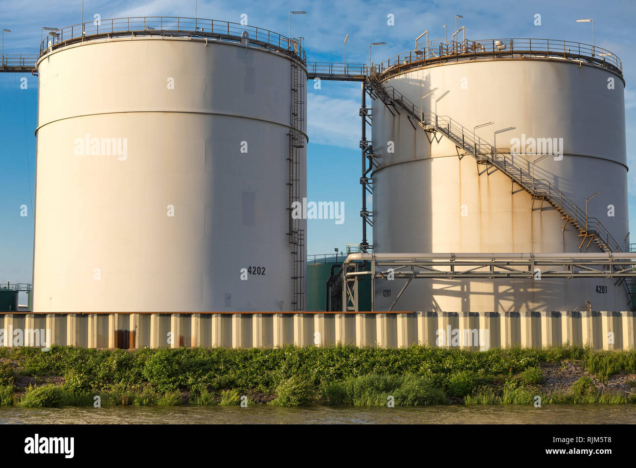 Two round silos in the Hamburg industrial port Stock Photo