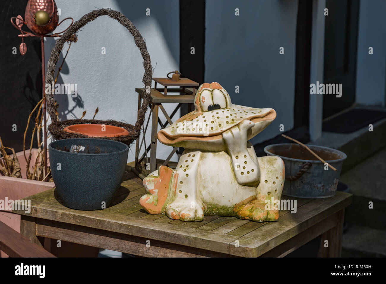 Decoration with a funny frog and old objects Stock Photo