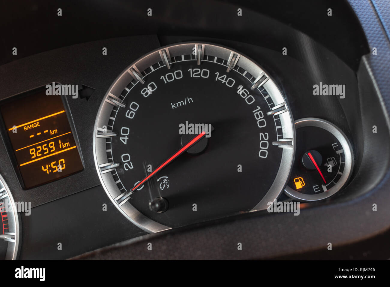 Low level fuel show on speedometer dashboard Stock Photo Alamy