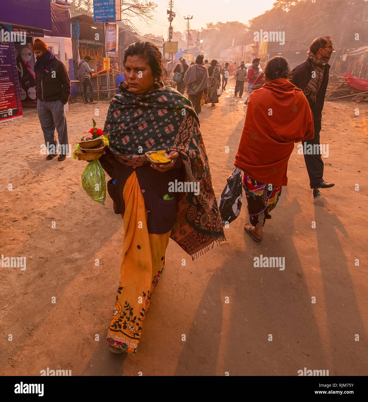 Gangasagar mela,Pilgrim,transit ,camp,Kolkata,female carrying morning,breakfast Stock Photo