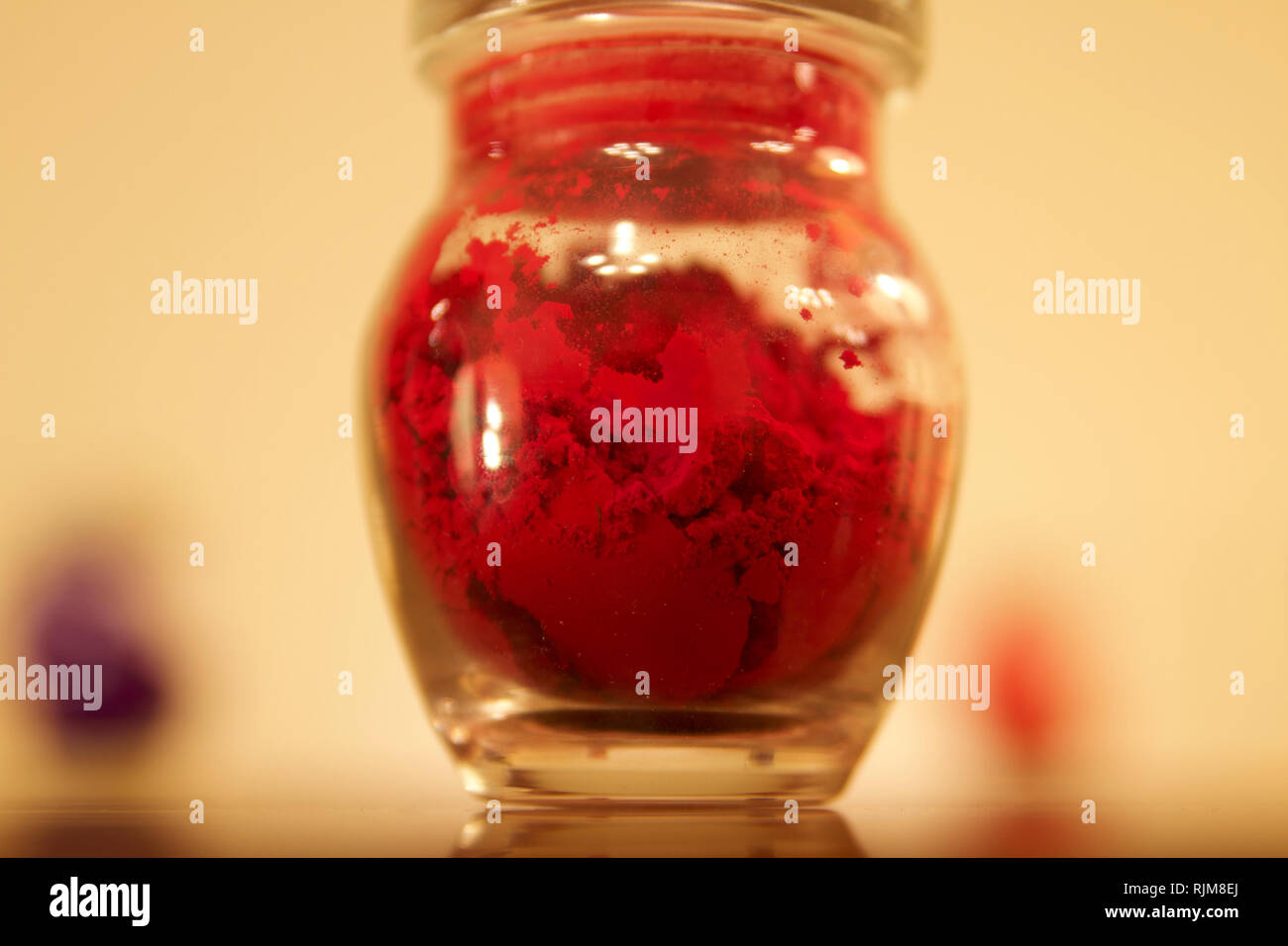 Dubai3 Glass jar set with purple red and green powder with red one on