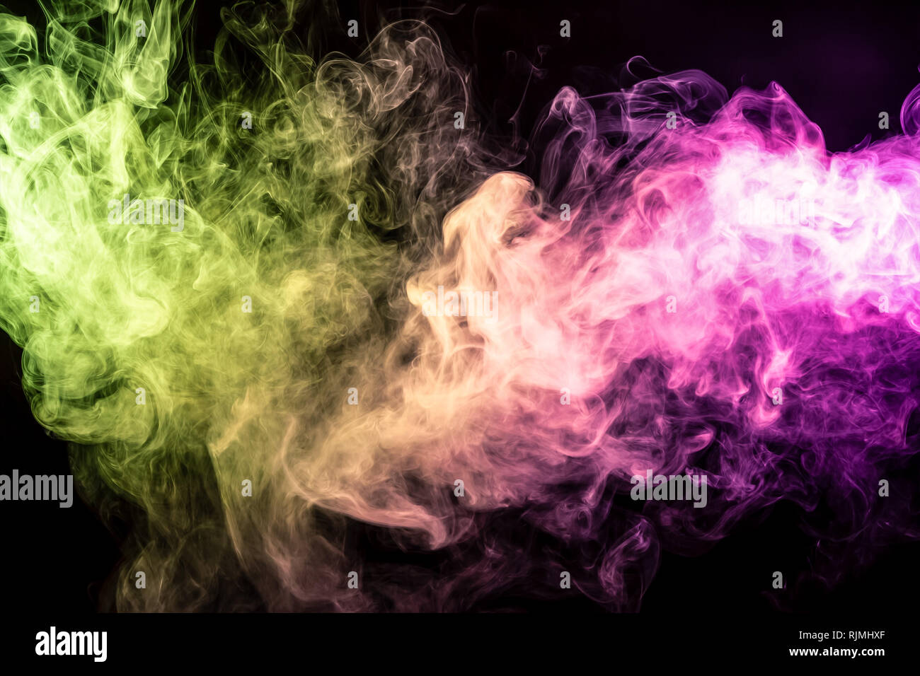 Abstract art colored yellow and pink smoke on black isolated background