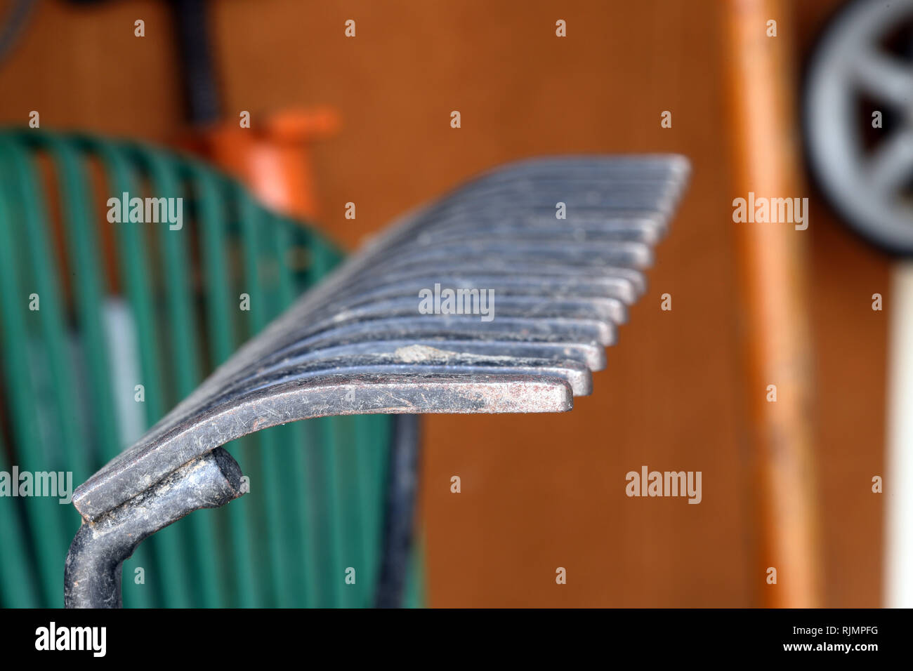 Garden Rake in garage, close-up - for use a background, graphics ...