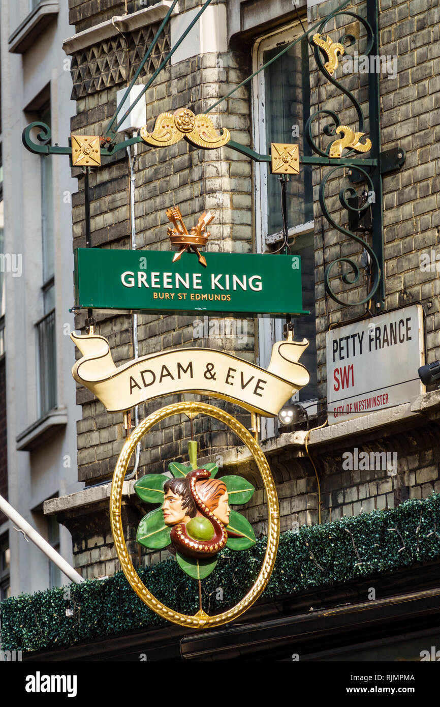 United Kingdom Great Britain England London Westminster Adam & Eve historic pub public house Greene King sign exterior sightseeing visitors t Stock Photo