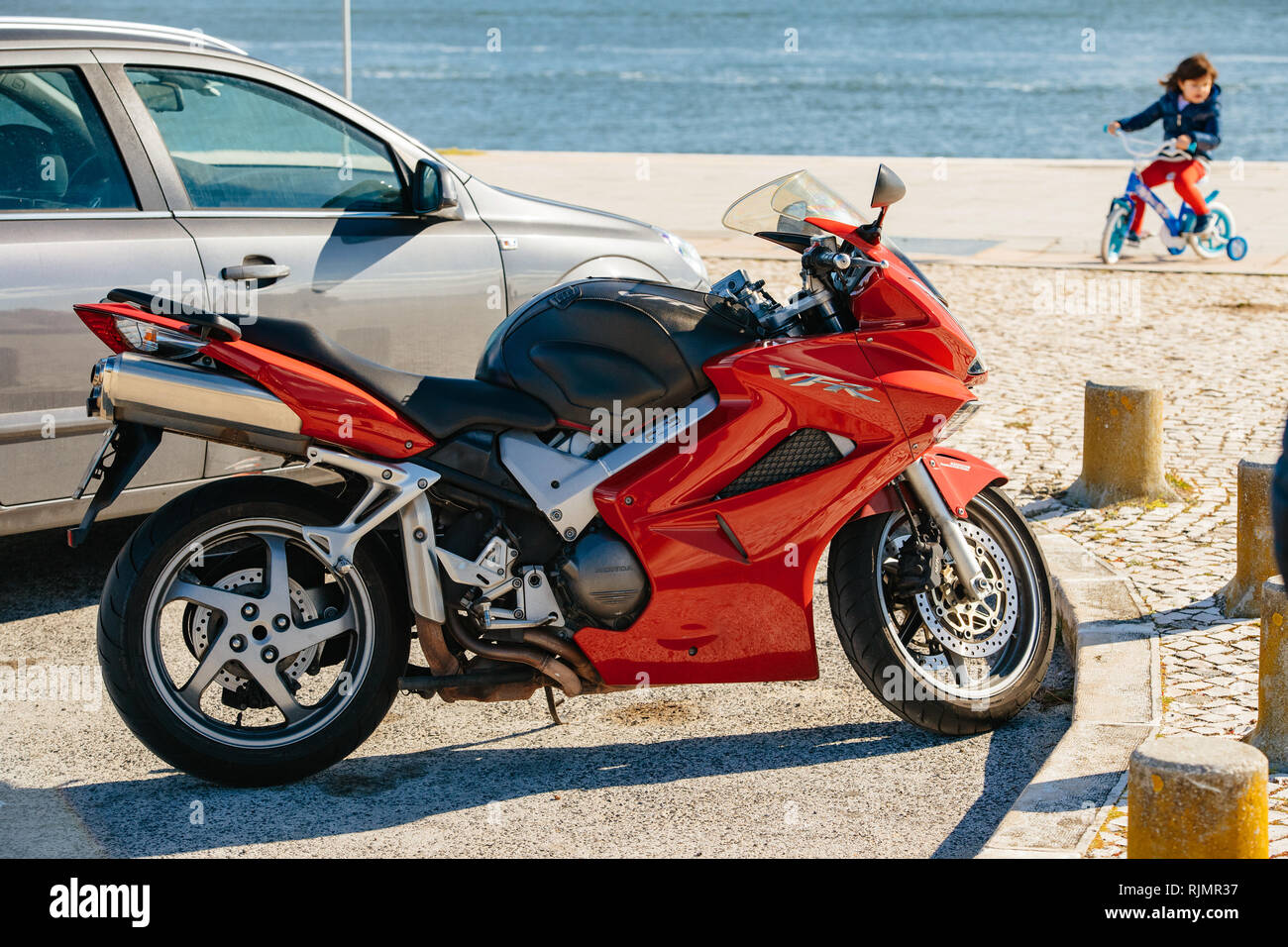 LISBON, PORTUGAL - FEB 10, 2018: Side view of trendy Honda VFR moto modern  motorcycle of red color parked on city street in sunlight Stock Photo -  Alamy