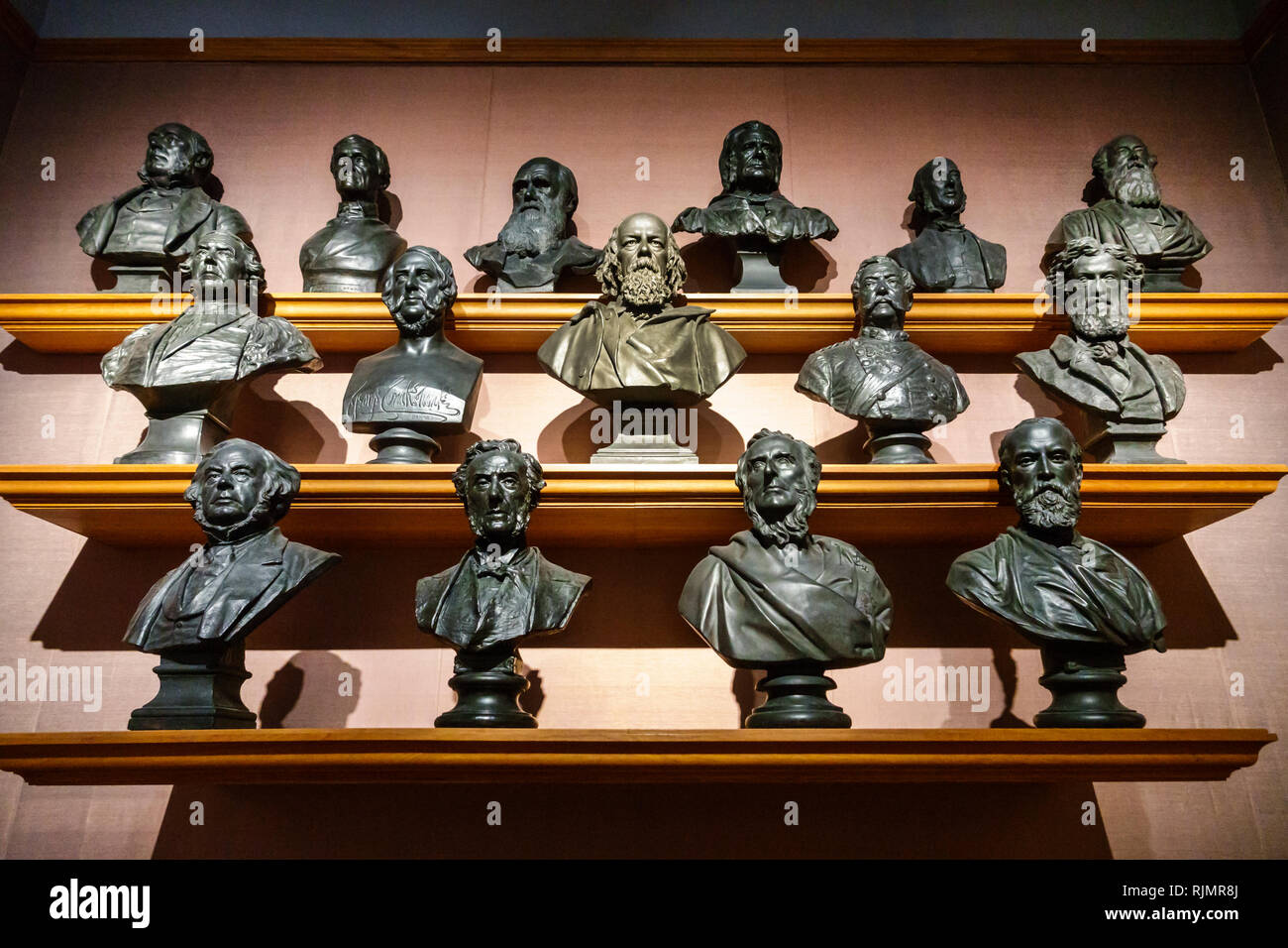 United Kingdom Great Britain England London Covent Garden National Portrait Gallery art museum interior sculpture wall busts Victorian notable Stock Photo