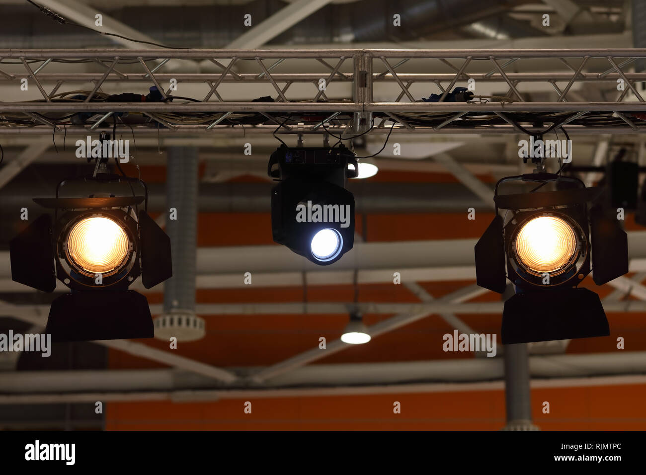 Various stage lights hanging on a truss Stock Photo - Alamy