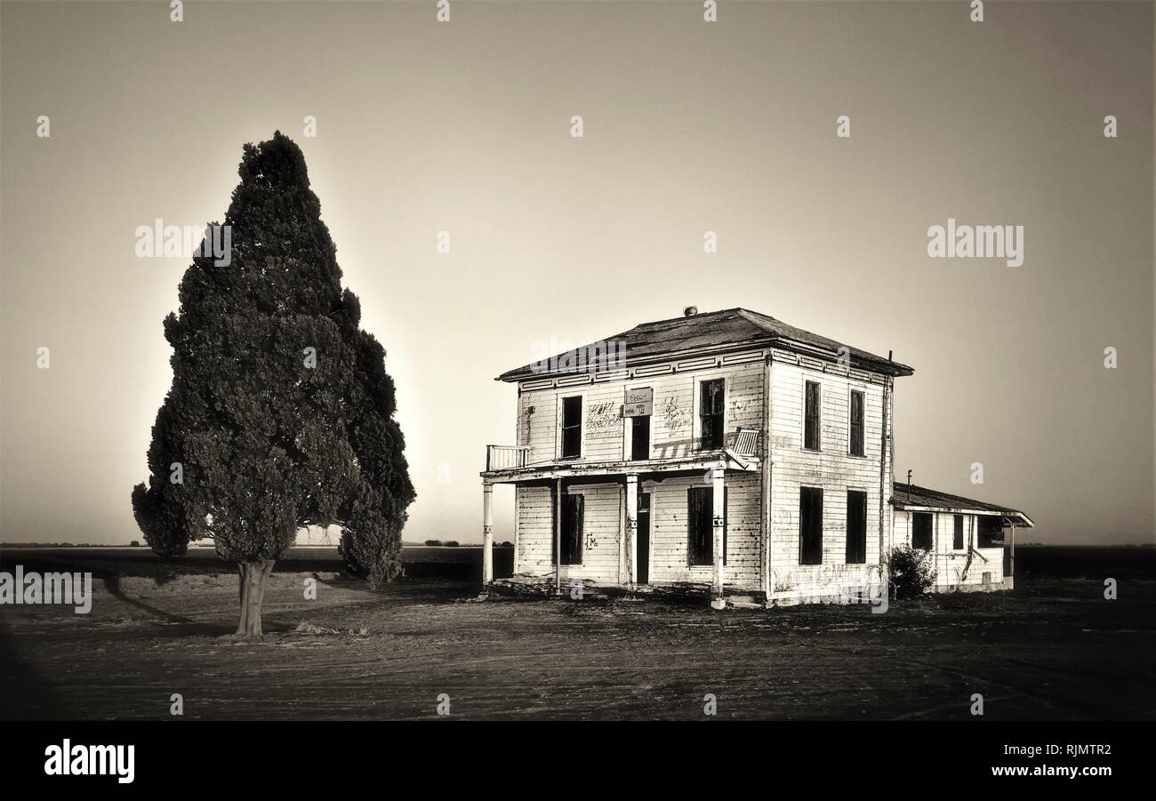 Abandoned farm house in central valley of California during drought
