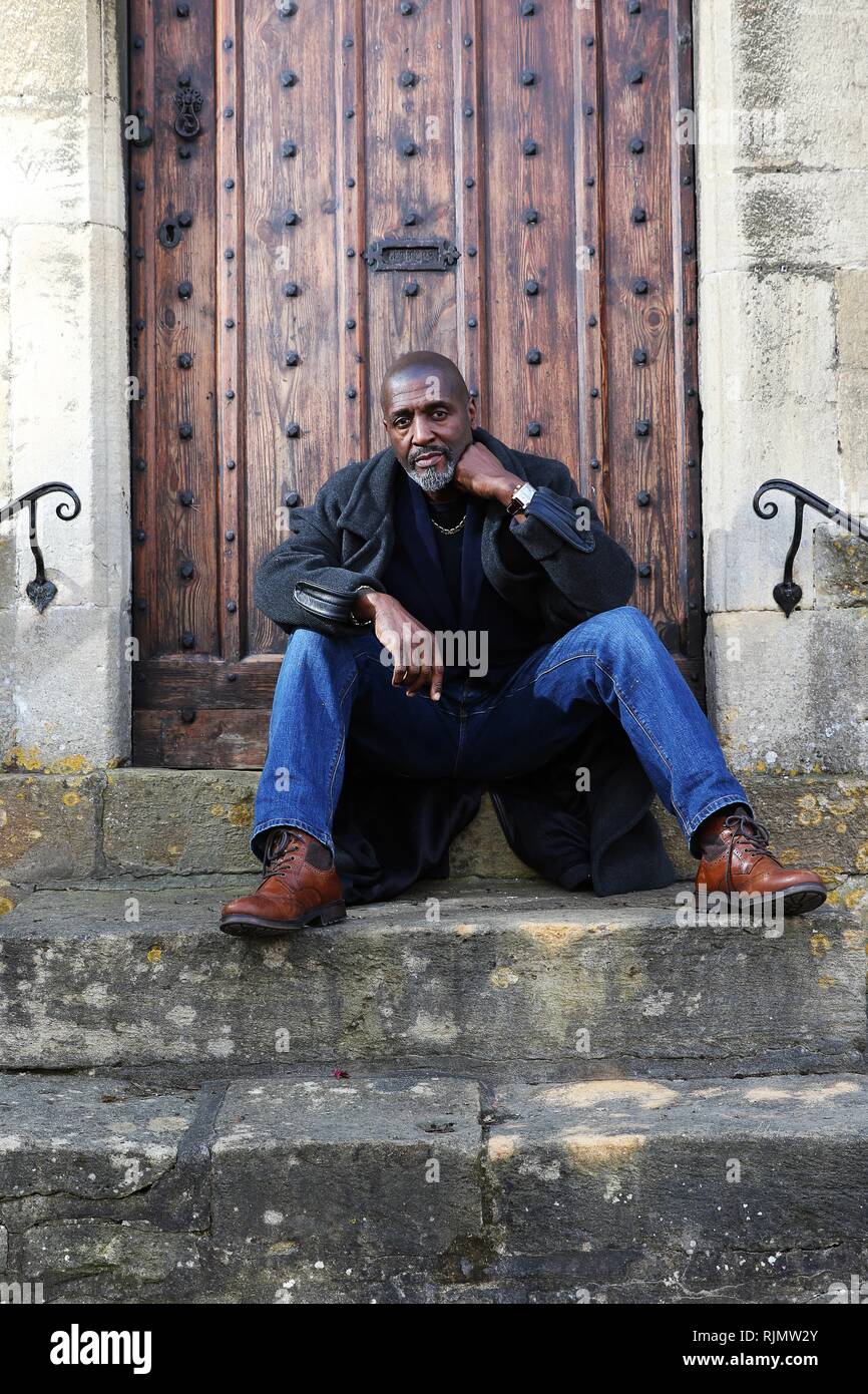 Micro artist Willard Wigan MBE who makes sculptures which fit within the eye of a needle, pictured at his exhibition in Broadway, Worcestershire. Stock Photo