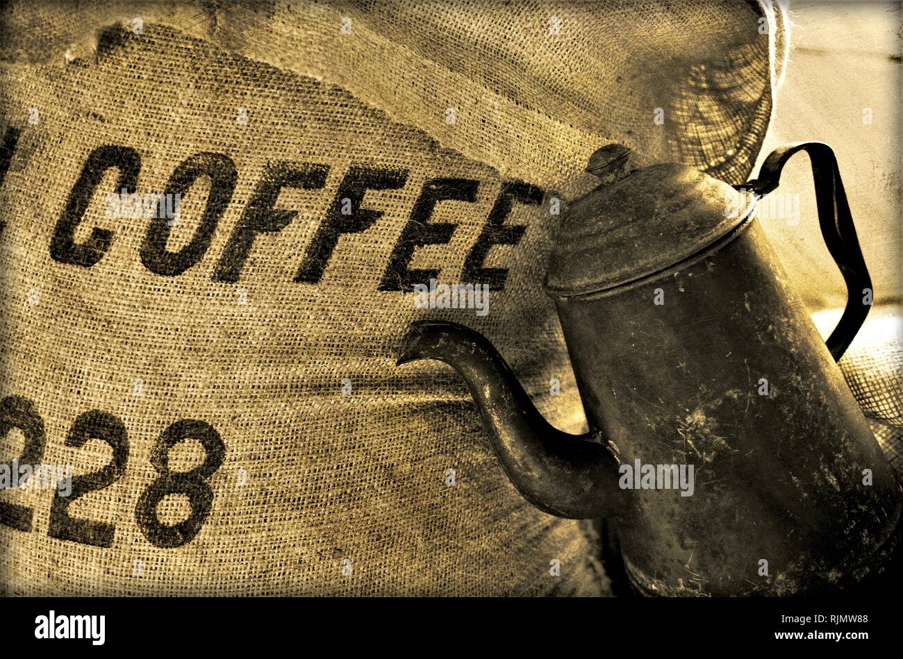 Imported coffee beans for roasting with old antique pot for brewing and