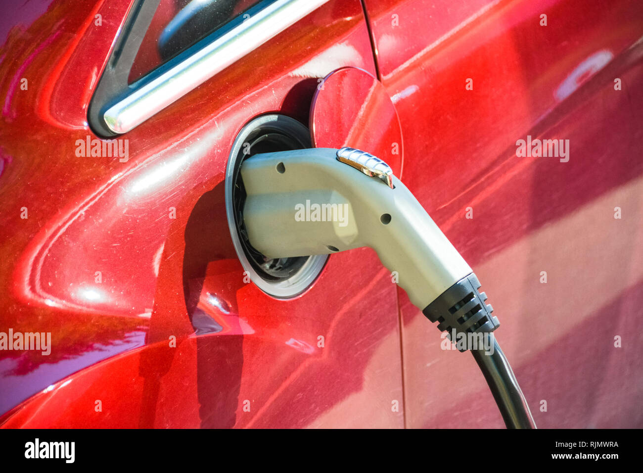 Electric vehicle charging. EV charge port and quick charging socket. Stock Photo