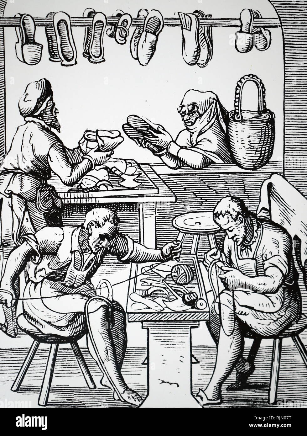 Woodcut showing a shoemaker; 16th century by Jos t Amman Stock Photo