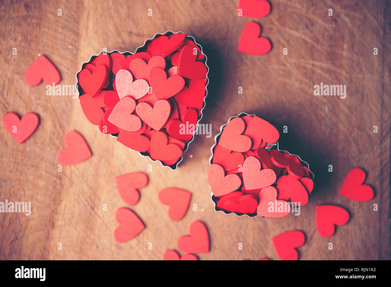 The red Heart shapes on abstract background in love concept for
