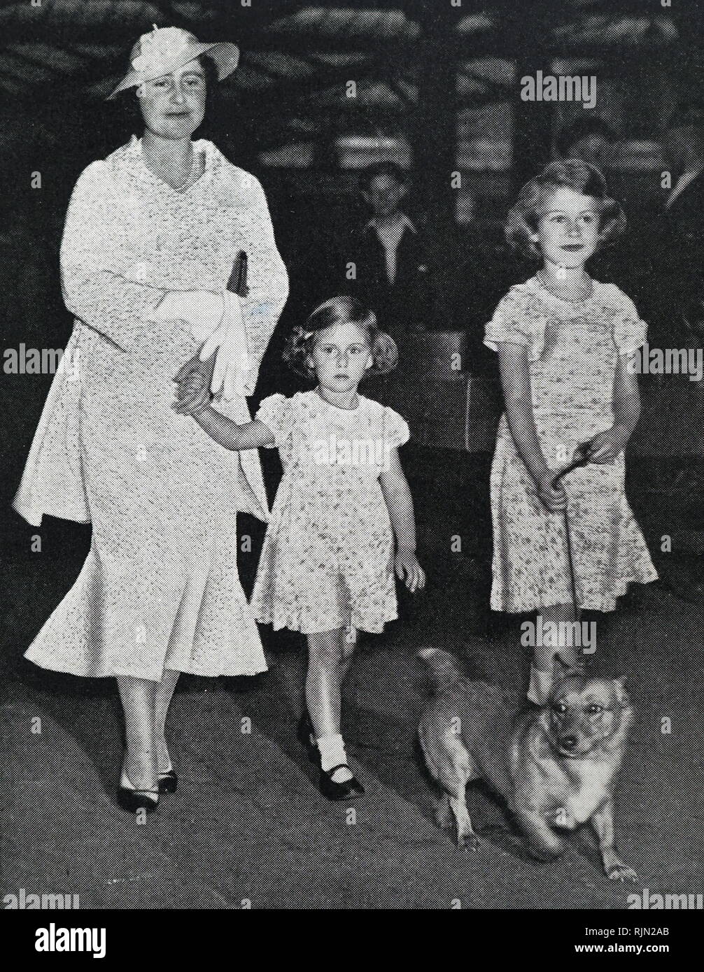 Queen Elizabeth (Later the Queen Mother) with Princess Elizabeth and Princess Margaret circa 1936 Stock Photo