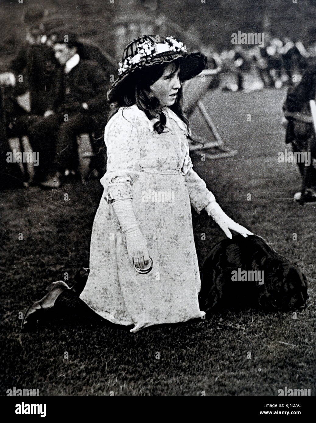 Lady Elizabeth Bowes Lyon (later Queen consort Elizabeth of Great Britain), dressed up for a garden party in the grounds of Glamis Castle. 1907 - 1908 Stock Photo
