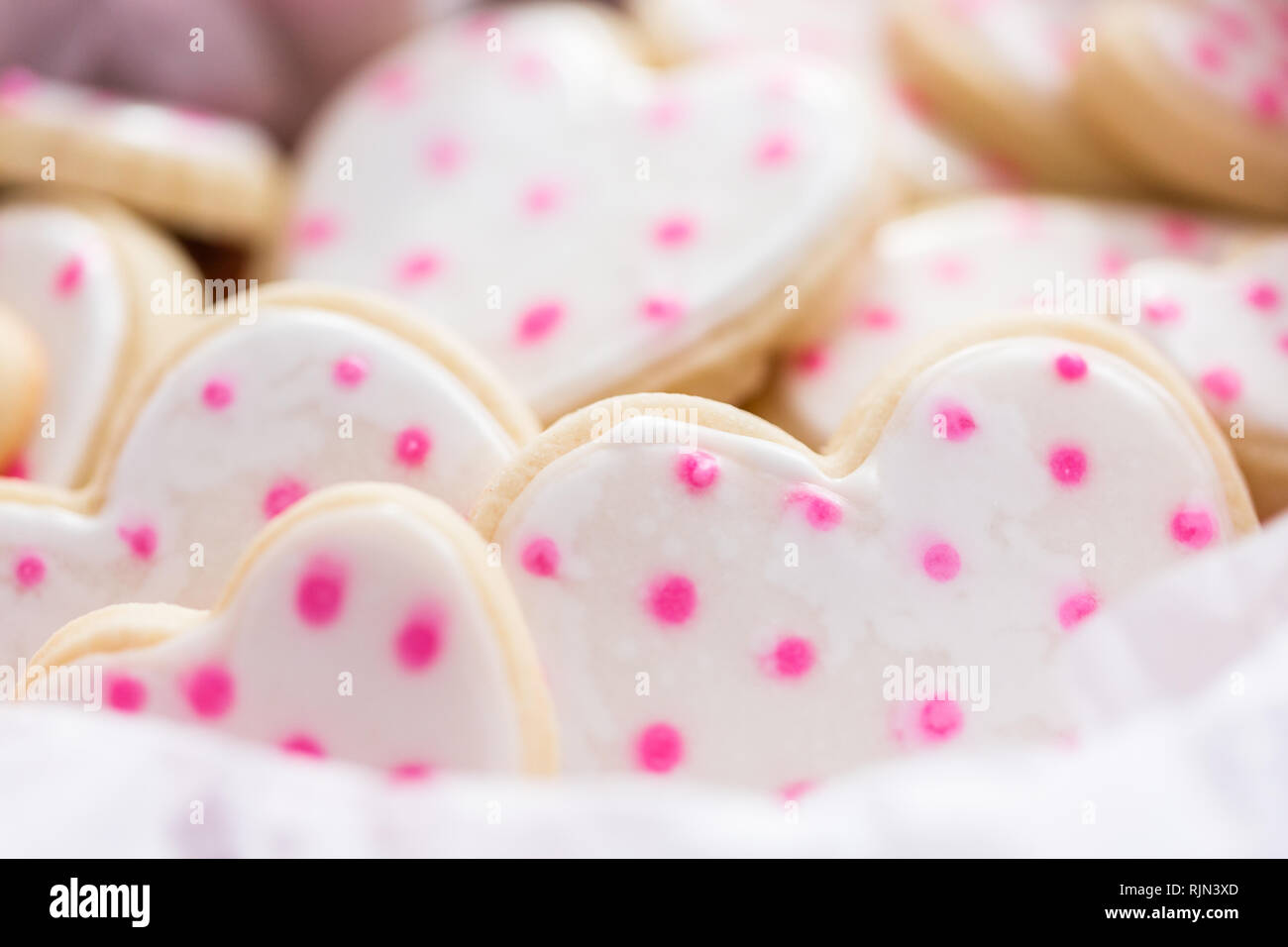 Heart shaped sugar cookies decorated with royal icing in gift box Stock