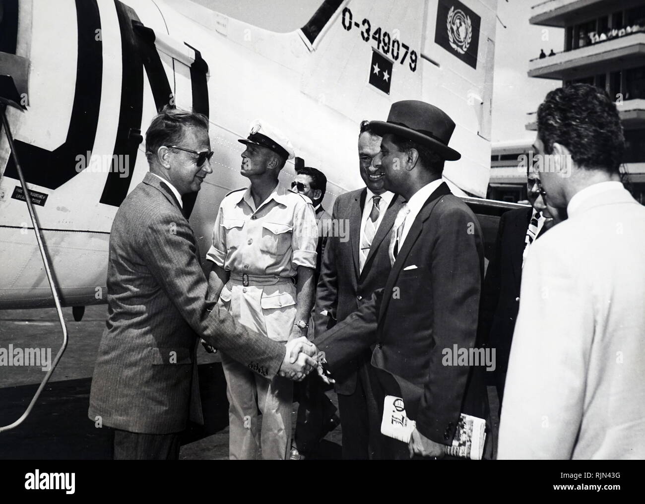 Secretary-General Dag Hammarskjold left New York on 17 June 1958, to attend the first meetings of the UN Observation Group in Lebanon. seen here (left) at Beirut Airport shaking hands with one of the members of UNOGIL, Ambassador Rajeshwar DAYAL (India) Stock Photo