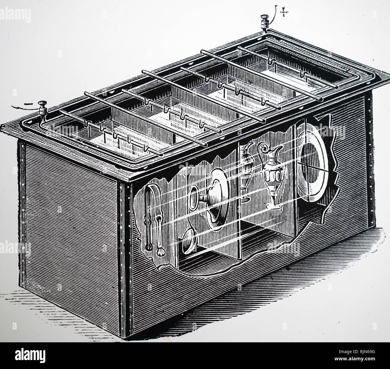 Illustration showing Electroplating bath with part of the side cut away to show arrangement of items to be silver plated 1904 Stock Photo