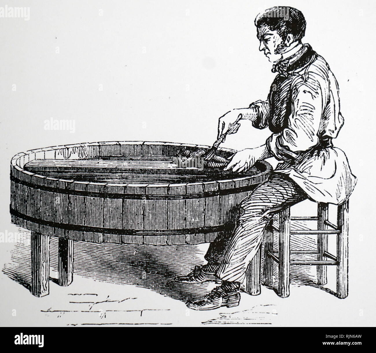 Illustration showing Workman polishing an electroplated object by hand; Paris; France. 1870 Stock Photo