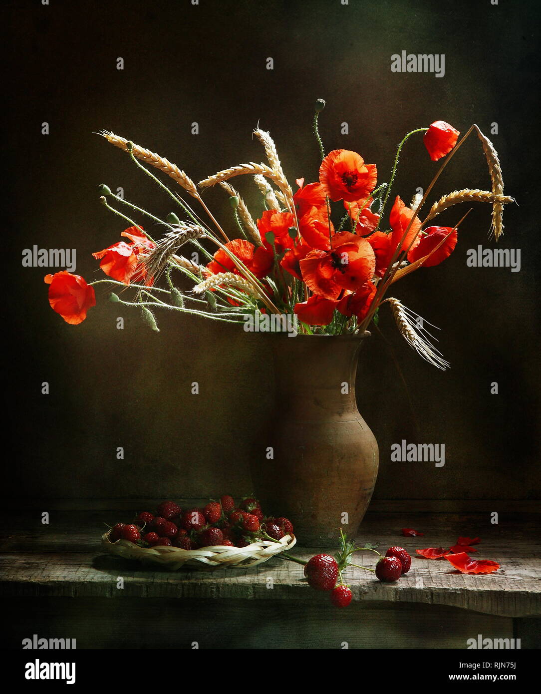 Still life with strawberries and a bouquet of poppies Stock Photo - Alamy