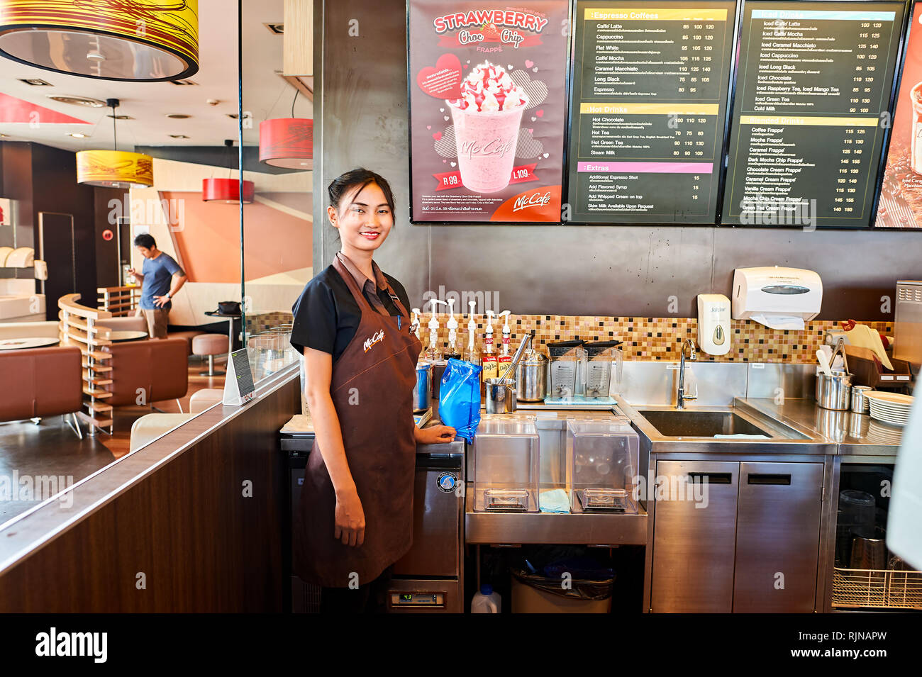 Mccafe Worker PATTAYA, THAILAND - FEBRUARY 21, 2016: worker at McCafe in Thailand ...