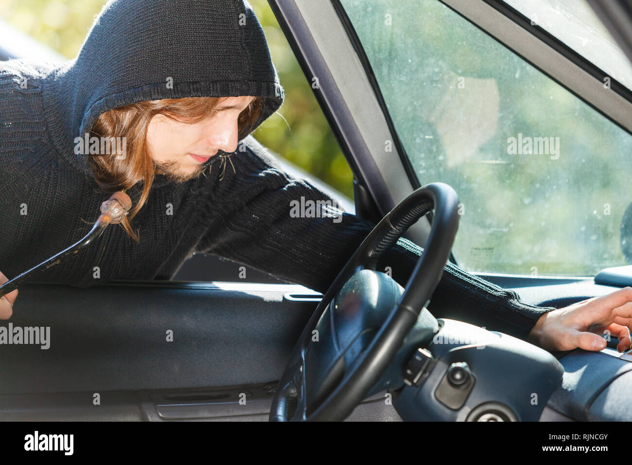 Anti theft system problem concept. Burglar thief man wearing black