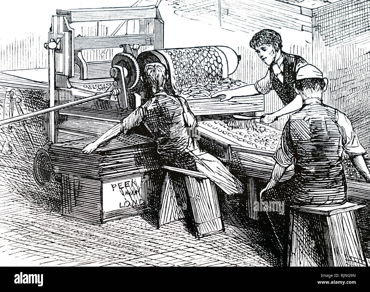 An engraving depicting the biscuit cutting machine of Peek, Frean & Co.'s biscuit factory, Southwark Park, London. Dated 19th century Stock Photo