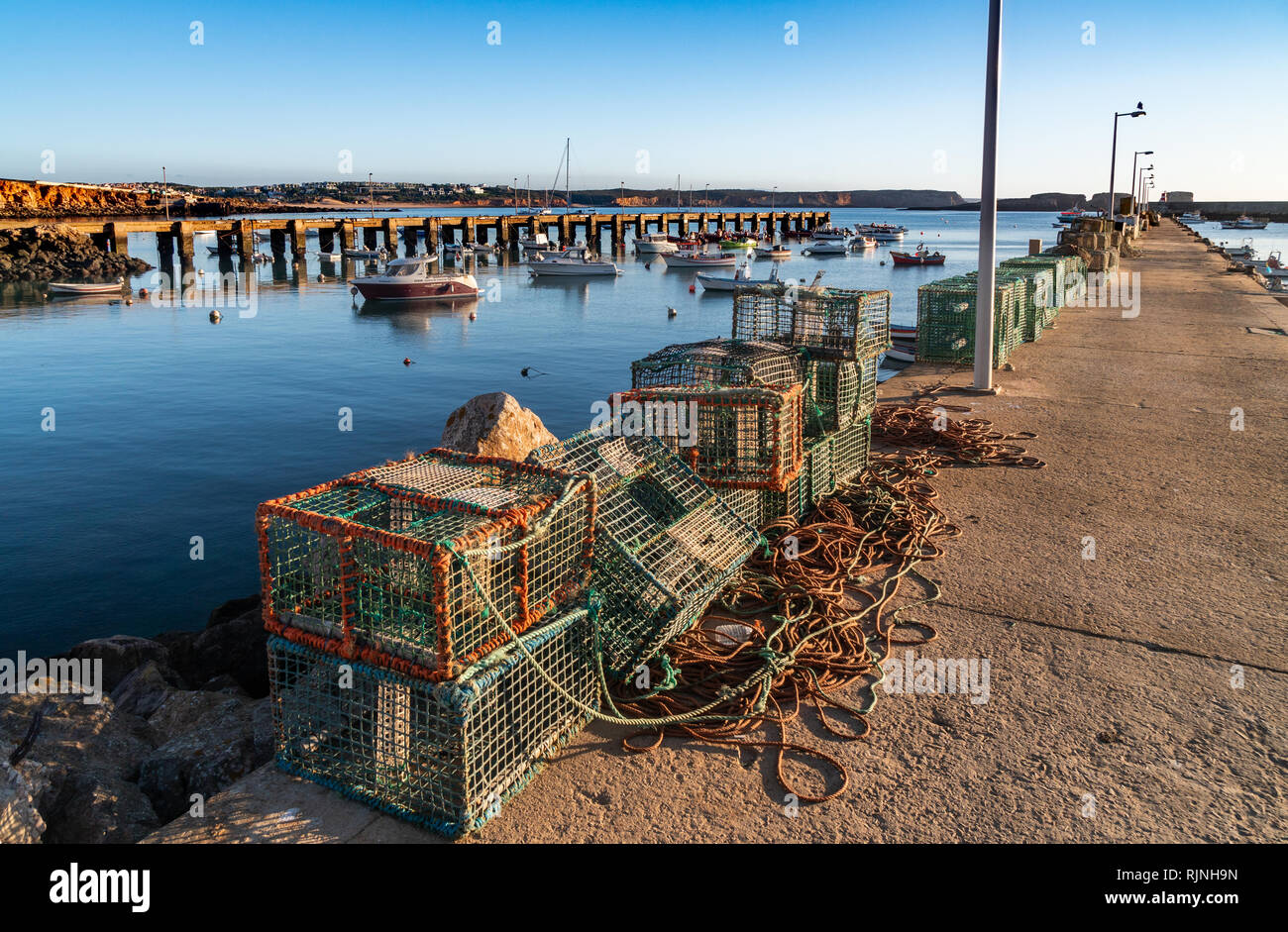 fisherman fishing net on the docks Stock Photo