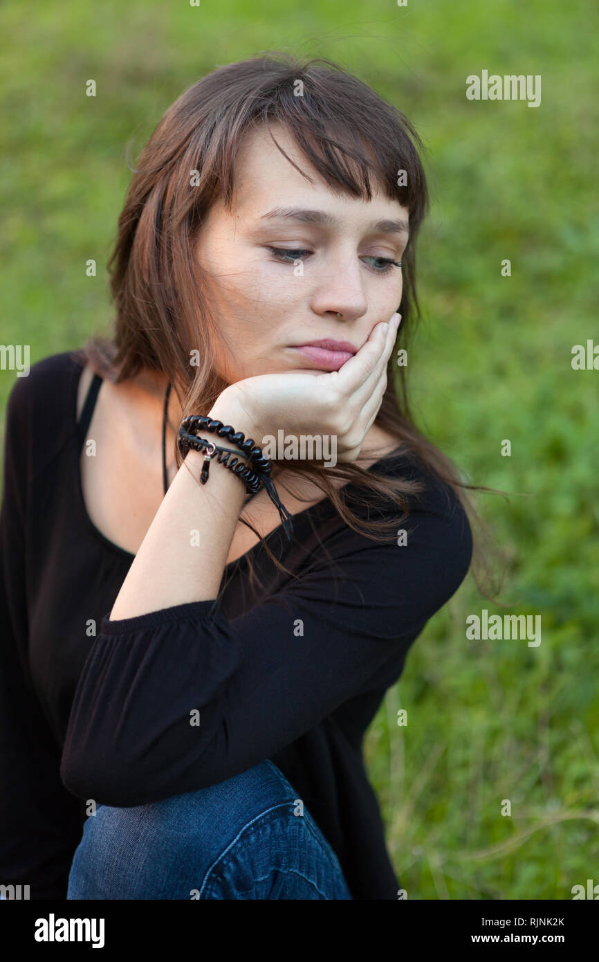 Beautiful woman with blue eyes in the park Stock Photo Alamy
