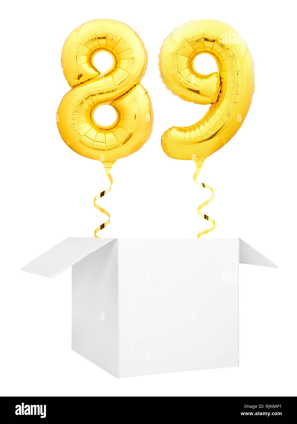 Golden number eighty nine inflatable balloon with golden ribbon flying out of blank white box isolated on white background Stock Photo