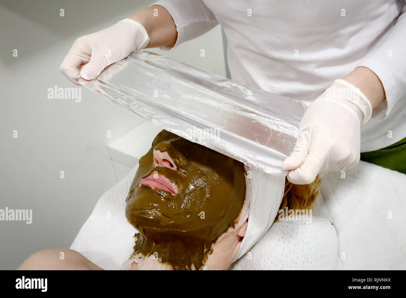 White girl puts on mask hi-res stock photography and images - Alamy