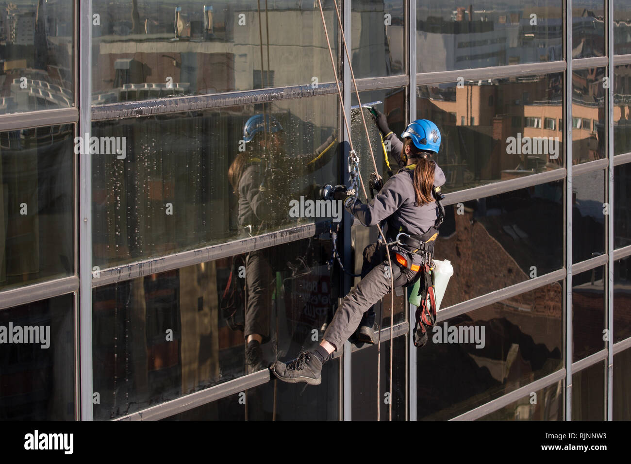 Abseiling Window Cleaners. Cleaning Windows at The Crowne Plaza in Nottingham City Centre Stock Photo