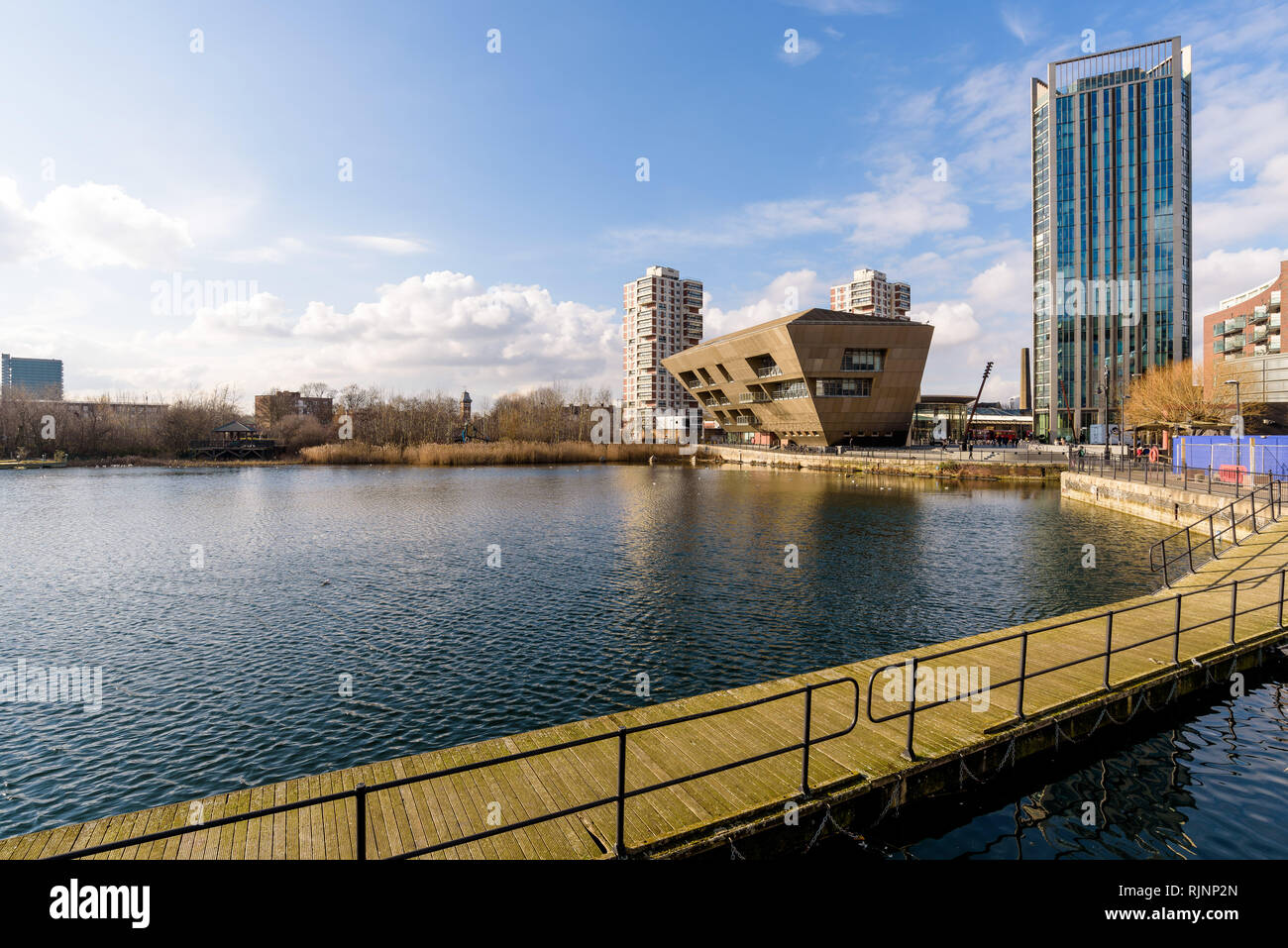 The Canada Water library seen across the Surrey Quays pond on a sunny day. London, England. Stock Photo